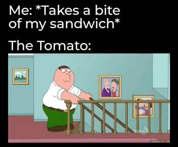 Takes a bite of the sandwich