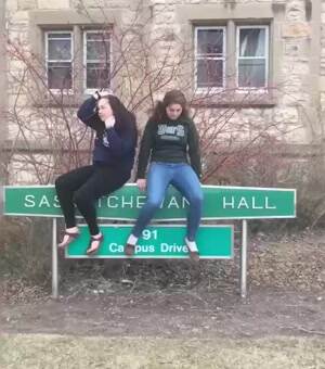 falling off a street sign