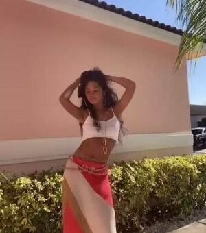 Shaking her skinny stomach