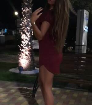 Showing off her red dress