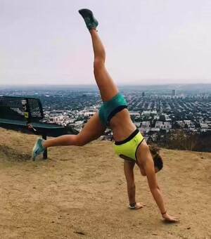 Showing off her handstands