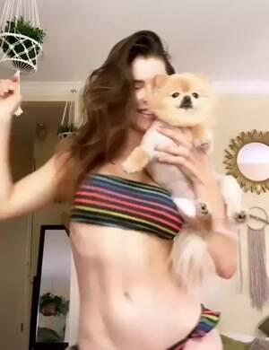 Amanda Cerny dancing with her puppy