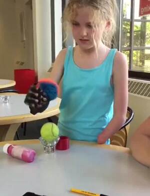 8 year old trying out her bionic arm for the first time