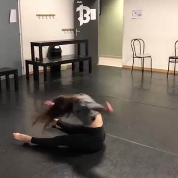 A dancer standing up