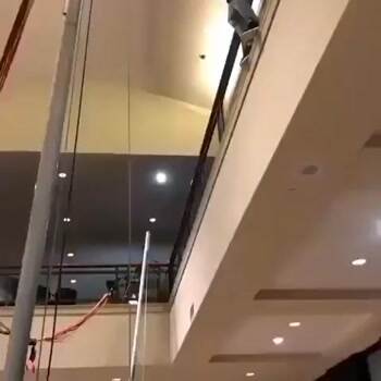 Amazing second story jump onto a trampoline