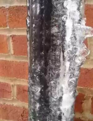 The ice on this frozen pipe is melting